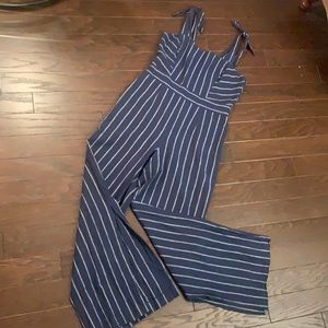 Stripped blue jumpsuit with adjustable tied straps